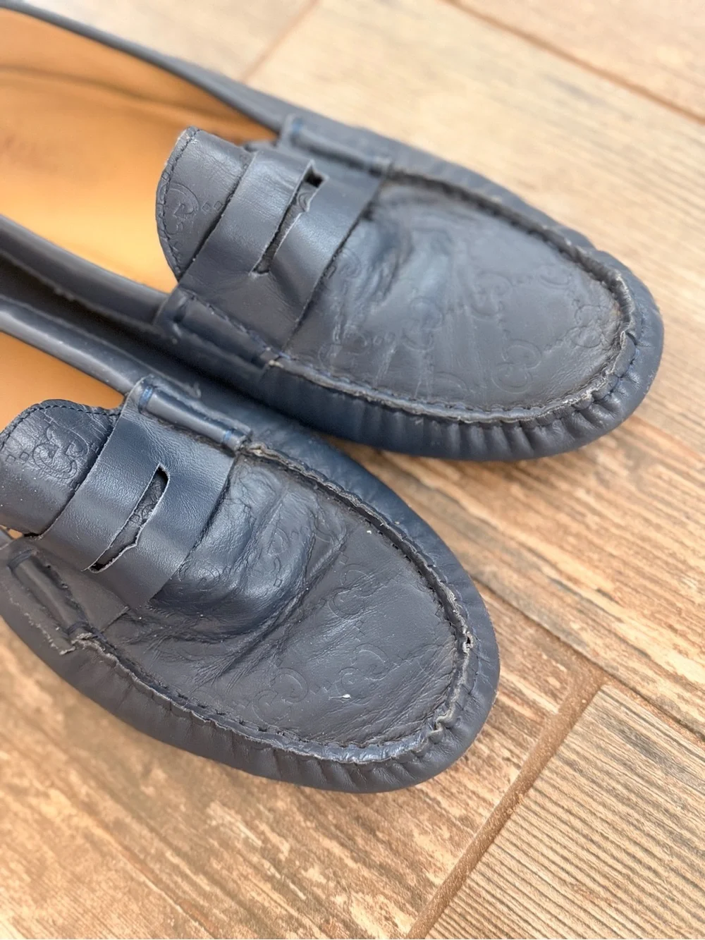 Gucci Navy Leather Penny Loafers with Embossed Logo